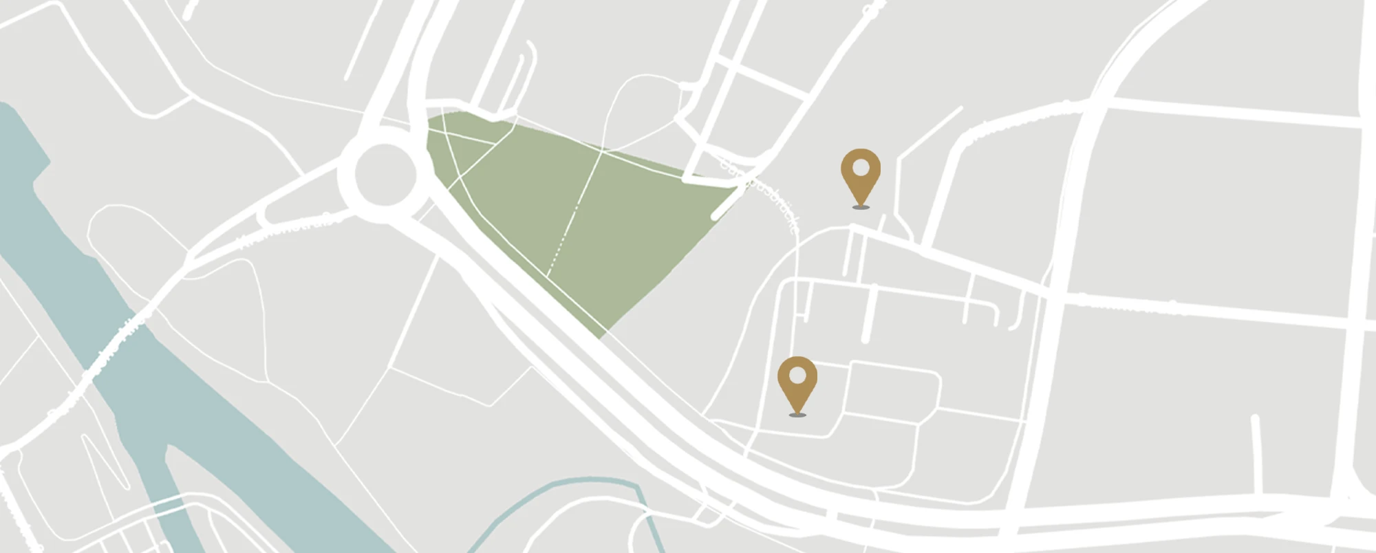 Voltino-Maps-Forum-am-Bildungscampus-neu Karte zeigt Straßen, einen Kreisverkehr, einen Fluss und zwei Markierungen nahe einem grünen Bereich auf einer Landkarte.